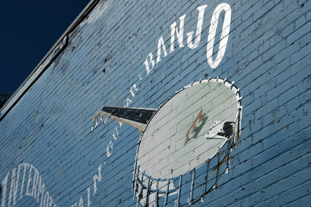 a brick wall with a clock painted on it